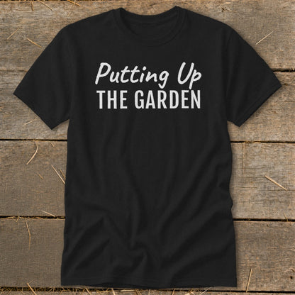 Black t-shirt with white text "Putting Up THE GARDEN"