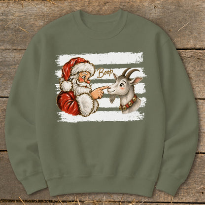 Santa booping a goat on the nose with "Boop" text on a sweatshirt.
