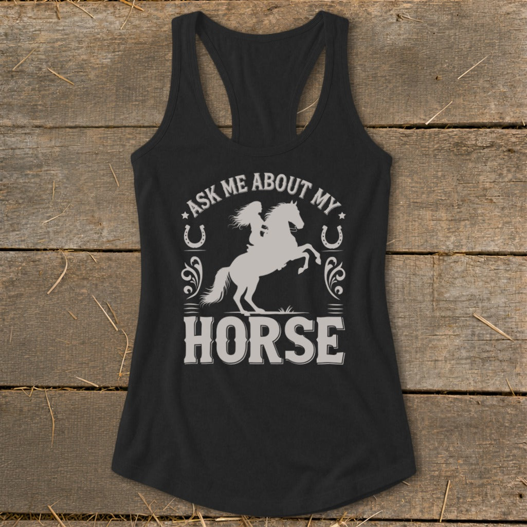 Black tank top with white graphic of a woman riding a horse and text "ASK ME ABOUT MY HORSE."