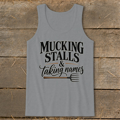 Grey tank top with "Mucking Stalls & Taking Names" text and a pitchfork.
