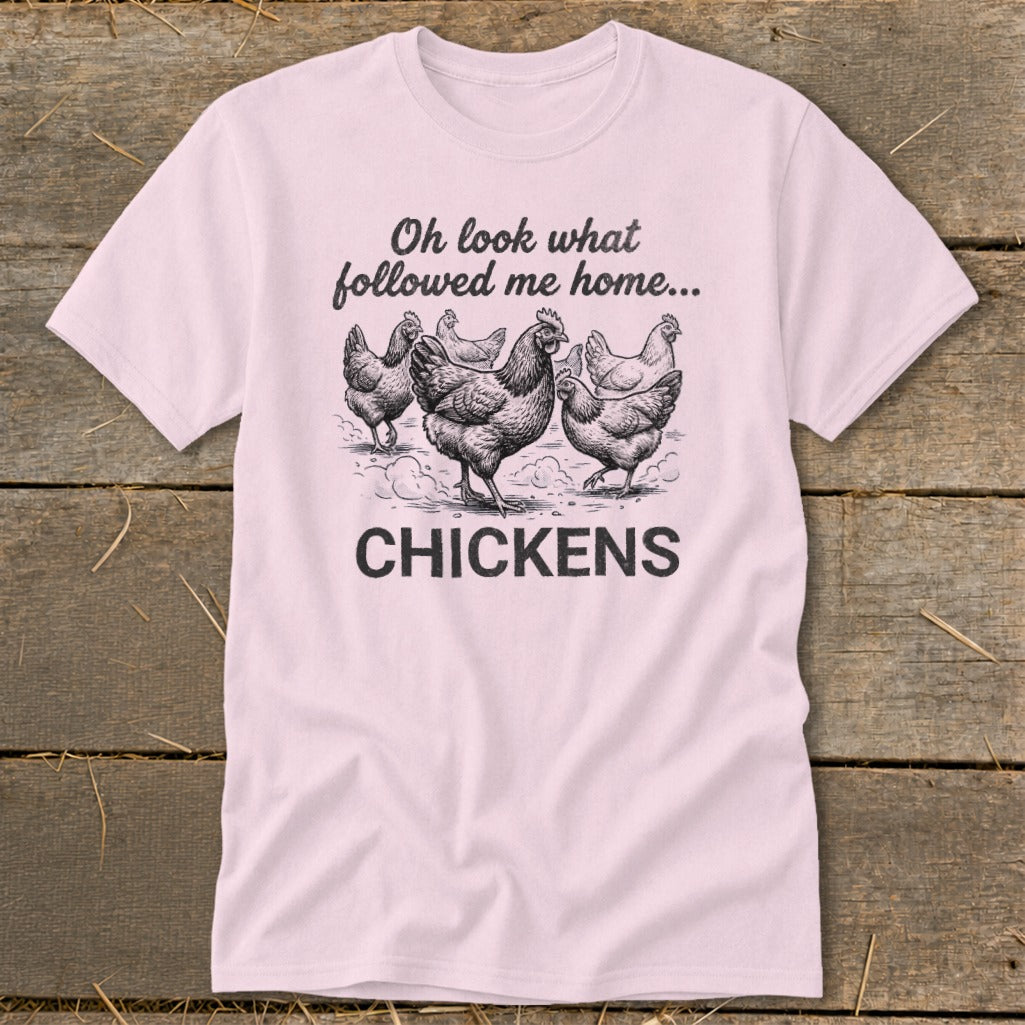 Light pink t-shirt with sketch of chickens and text "Oh look what followed me home... CHICKENS".