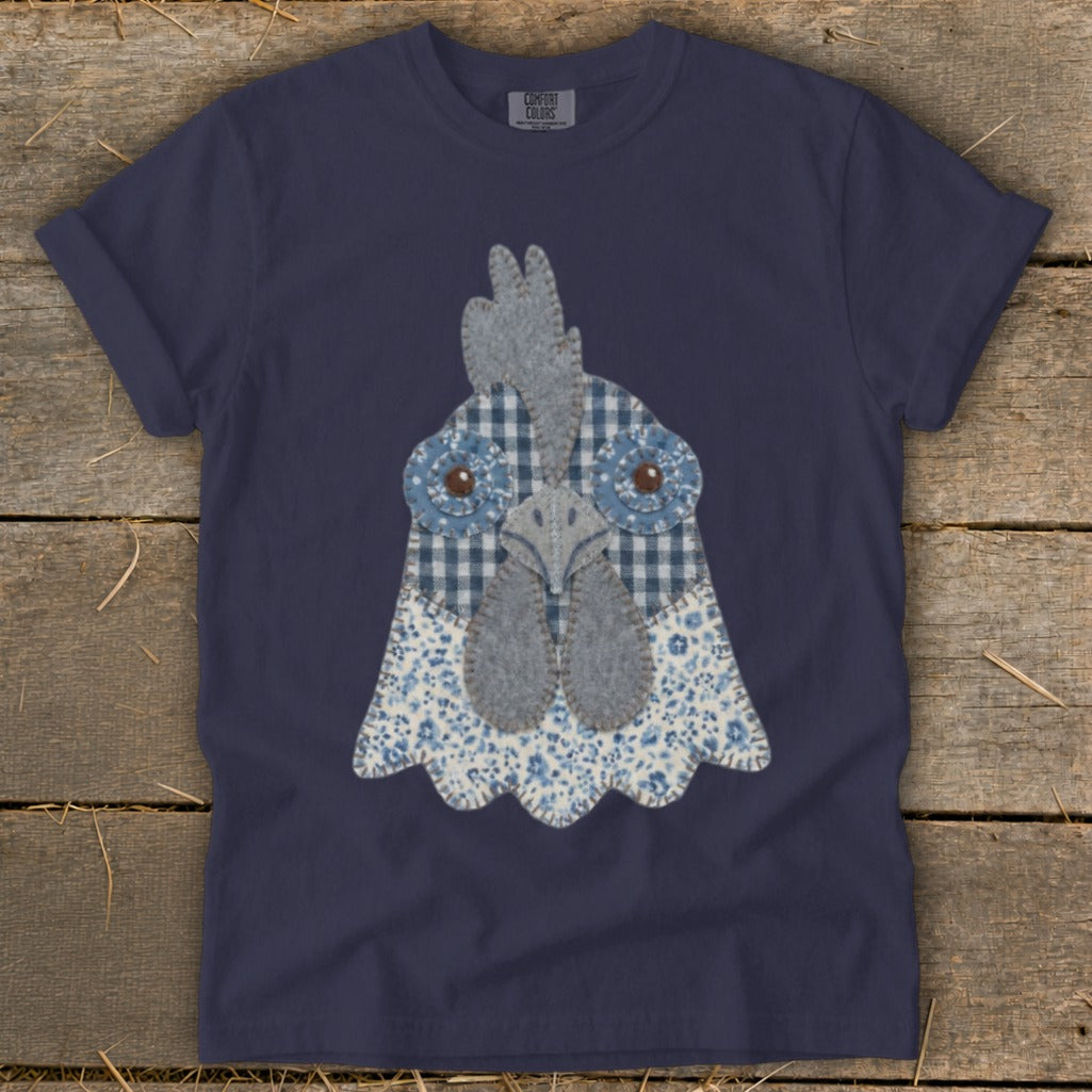 Navy t-shirt featuring a blue and white patchwork chicken head graphic.