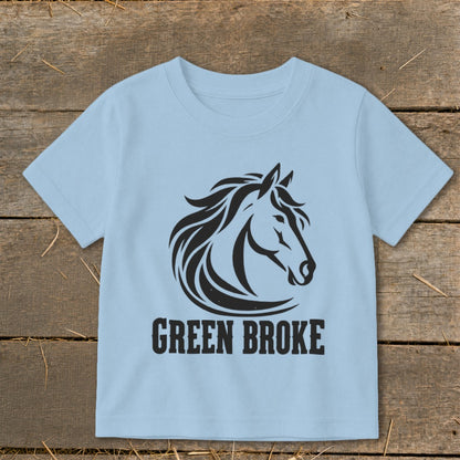 Light blue short-sleeved children's t-shirt featuring a black horse graphic and the text GREEN BROKE.