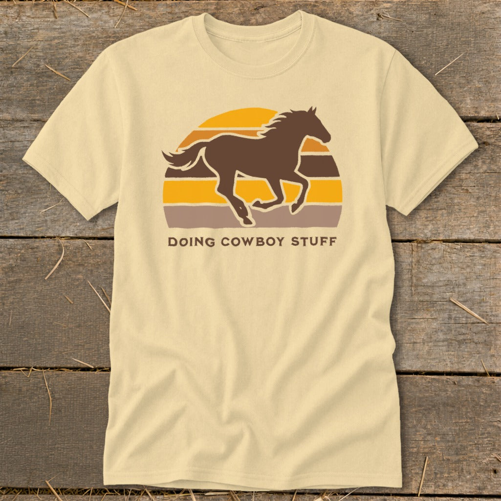 T-shirt with a running horse silhouette and "DOING COWBOY STUFF" text.