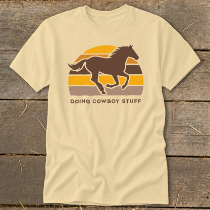 T-shirt with a running horse silhouette and "DOING COWBOY STUFF" text.