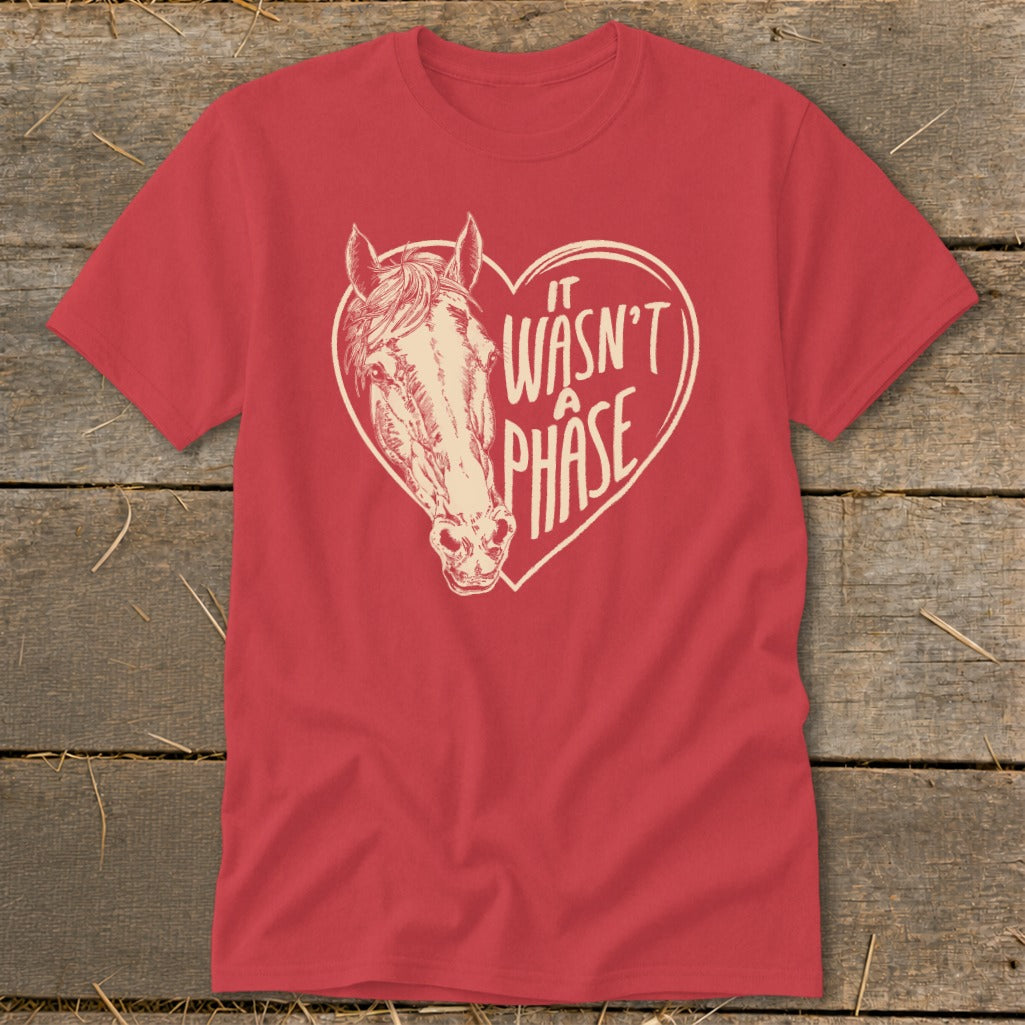 Red t-shirt with a heart graphic featuring a horse and text "It Wasn't a Phase".