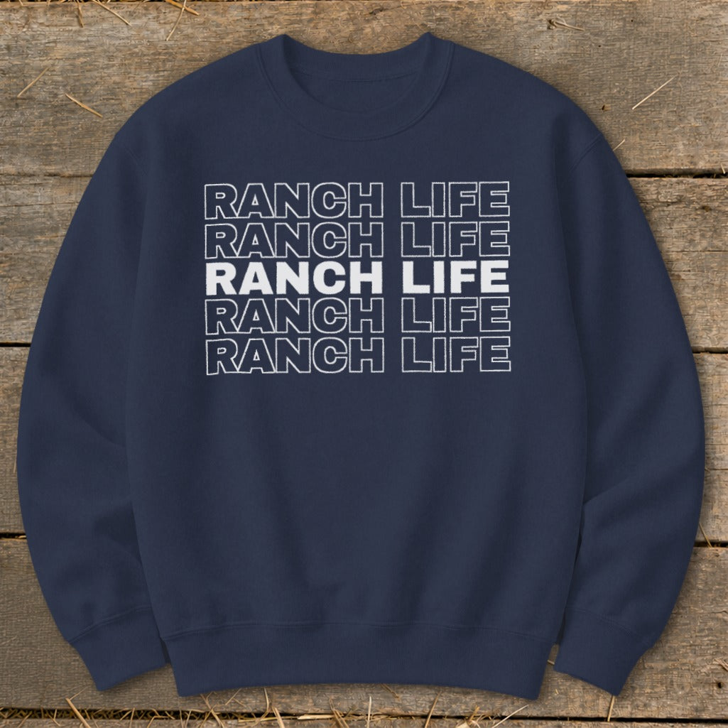 A dark blue crewneck sweatshirt with the text Ranch Life repeated in stacked white outlined letters.
