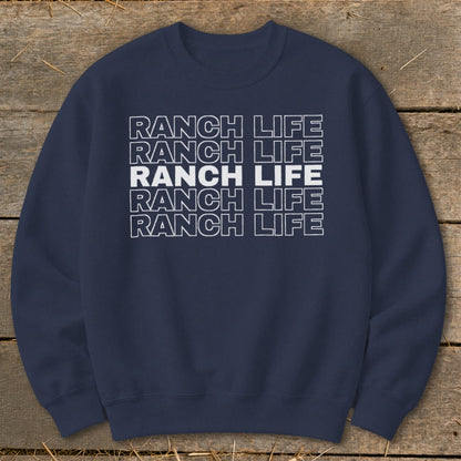 A dark blue crewneck sweatshirt with the text Ranch Life repeated in stacked white outlined letters.