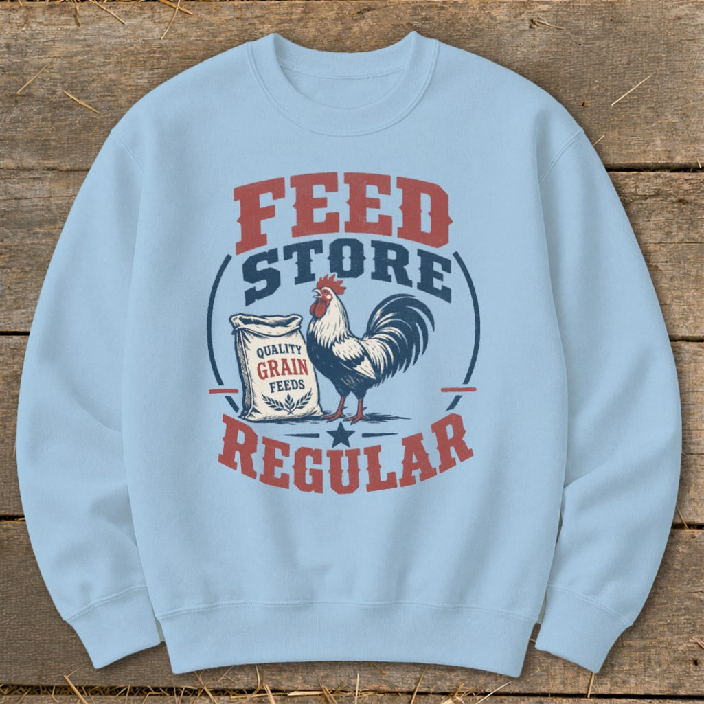 Light blue sweatshirt with "FEED STORE REGULAR" text and a rooster by a grain feed bag.