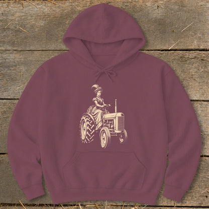 Maroon hoodie with a cream-colored vintage illustration of a woman in formal attire driving a tractor.