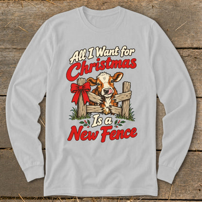 Light gray long-sleeve shirt with a Christmas graphic of a cow and the text "All I Want for Christmas Is a New Fence".