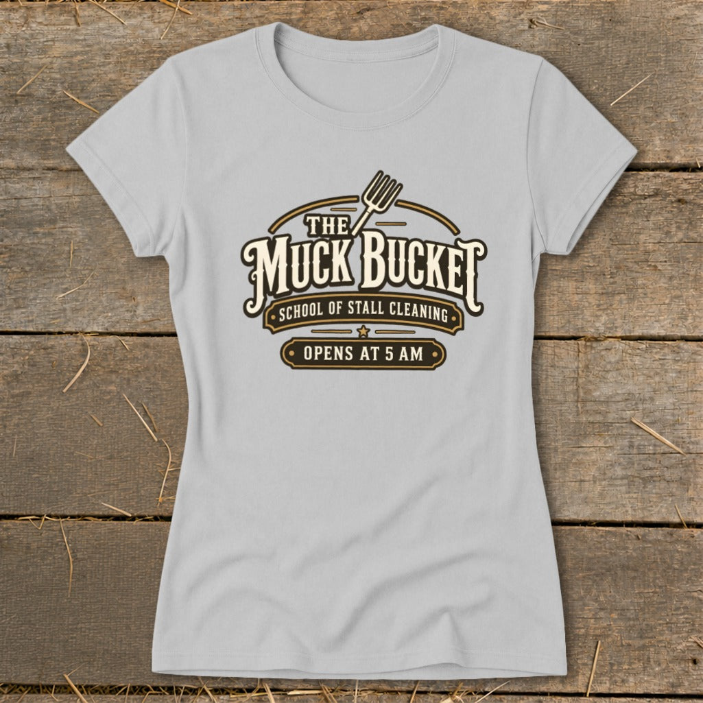 Gray t-shirt with "The Muck Bucket School of Stall Cleaning Opens At 5 AM" logo.