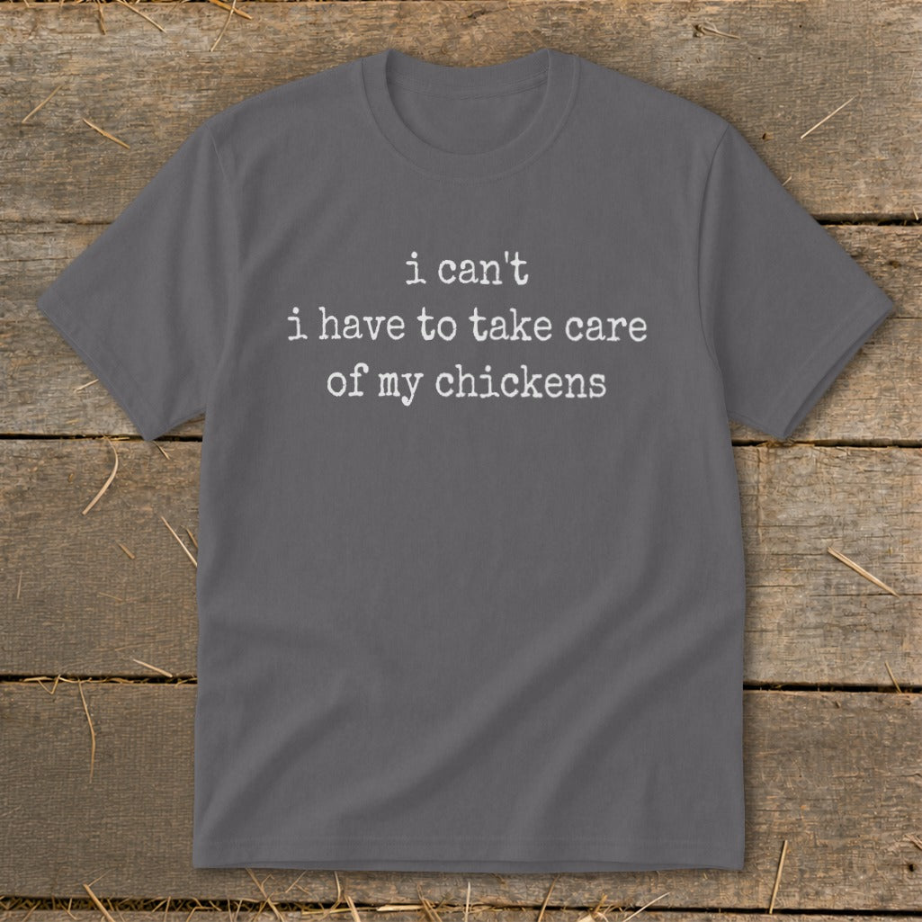 Gray t-shirt with white text: "i can't i have to take care of my chickens".
