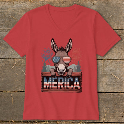 Donkey wearing sunglasses with American flag print over "MERICA" text and fireworks.