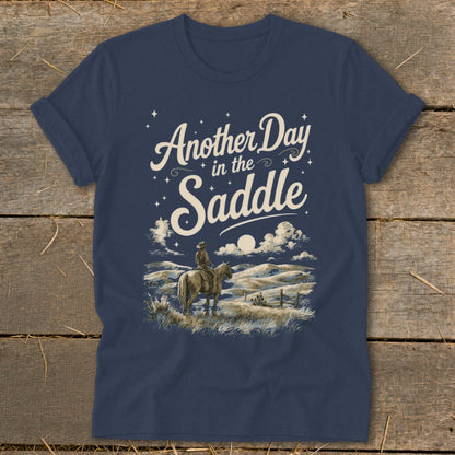 Navy t-shirt with "Another Day in the Saddle" text and cowboy on horseback art.