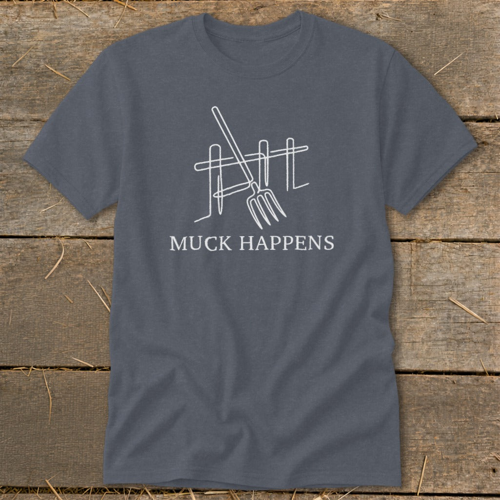 Grey t-shirt with white line art of pitchfork and fence, text "MUCK HAPPENS".