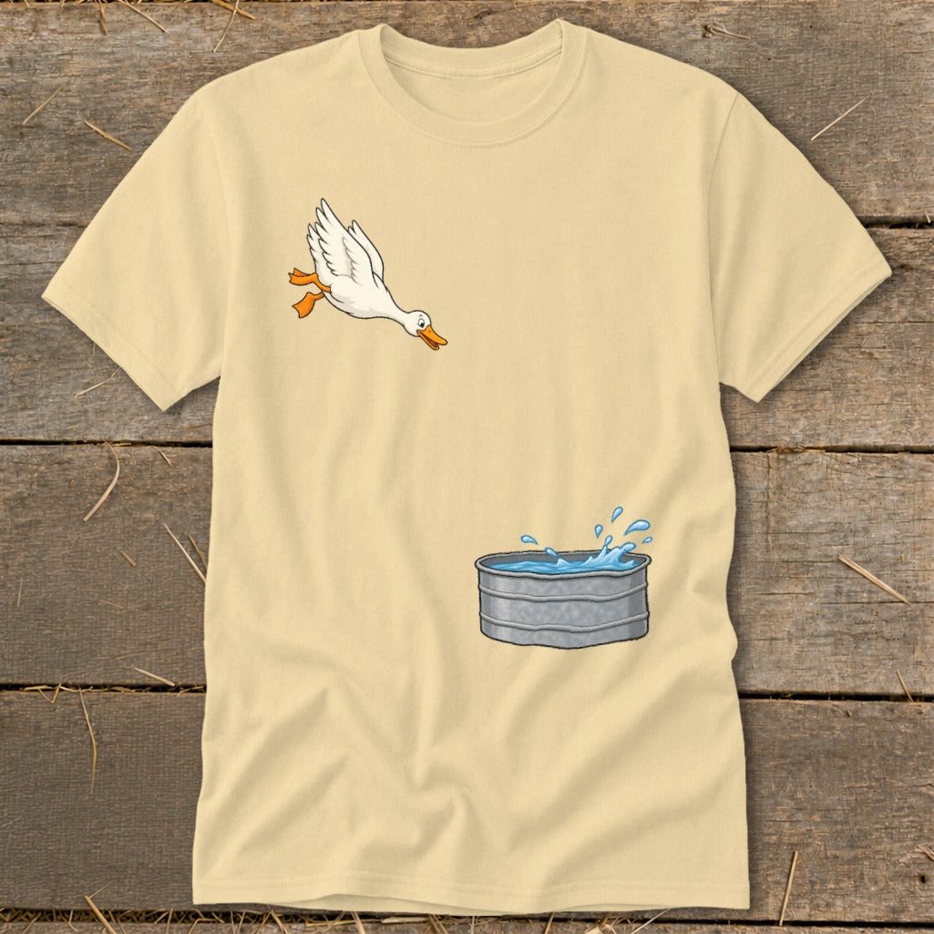 Light yellow t-shirt with cartoon of a goose jumping into a galvanized tub.