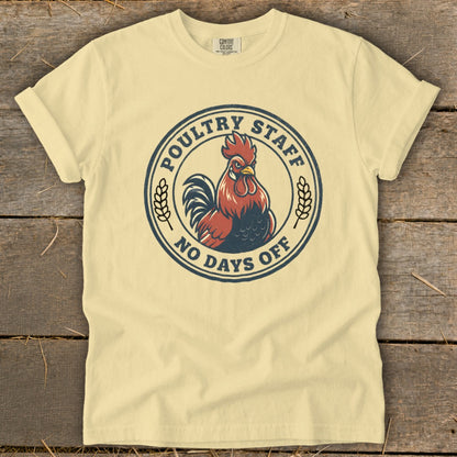 Cream t-shirt with a circular graphic of a rooster and text: Poultry Staff, No Days Off.