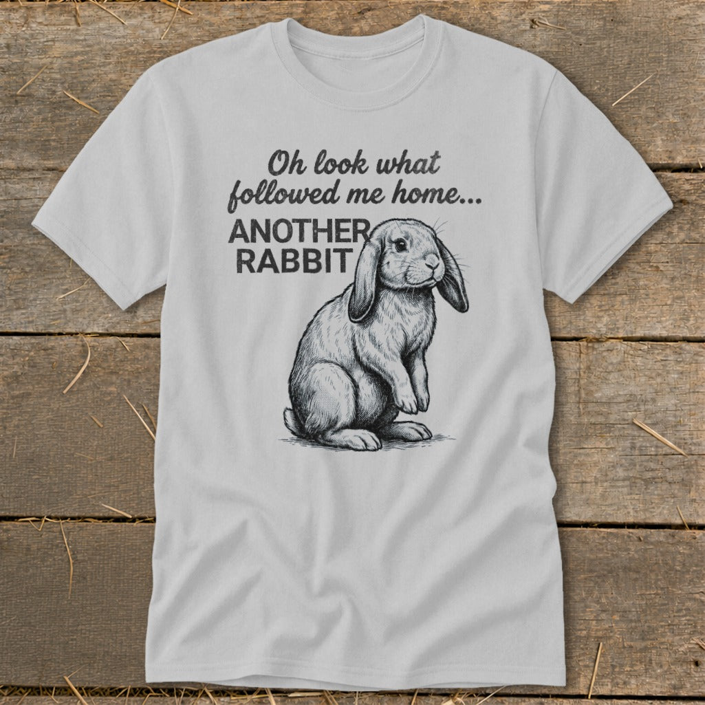 Light grey t-shirt with sketch of lop-eared rabbit and text "Oh look what followed me home... ANOTHER RABBIT."