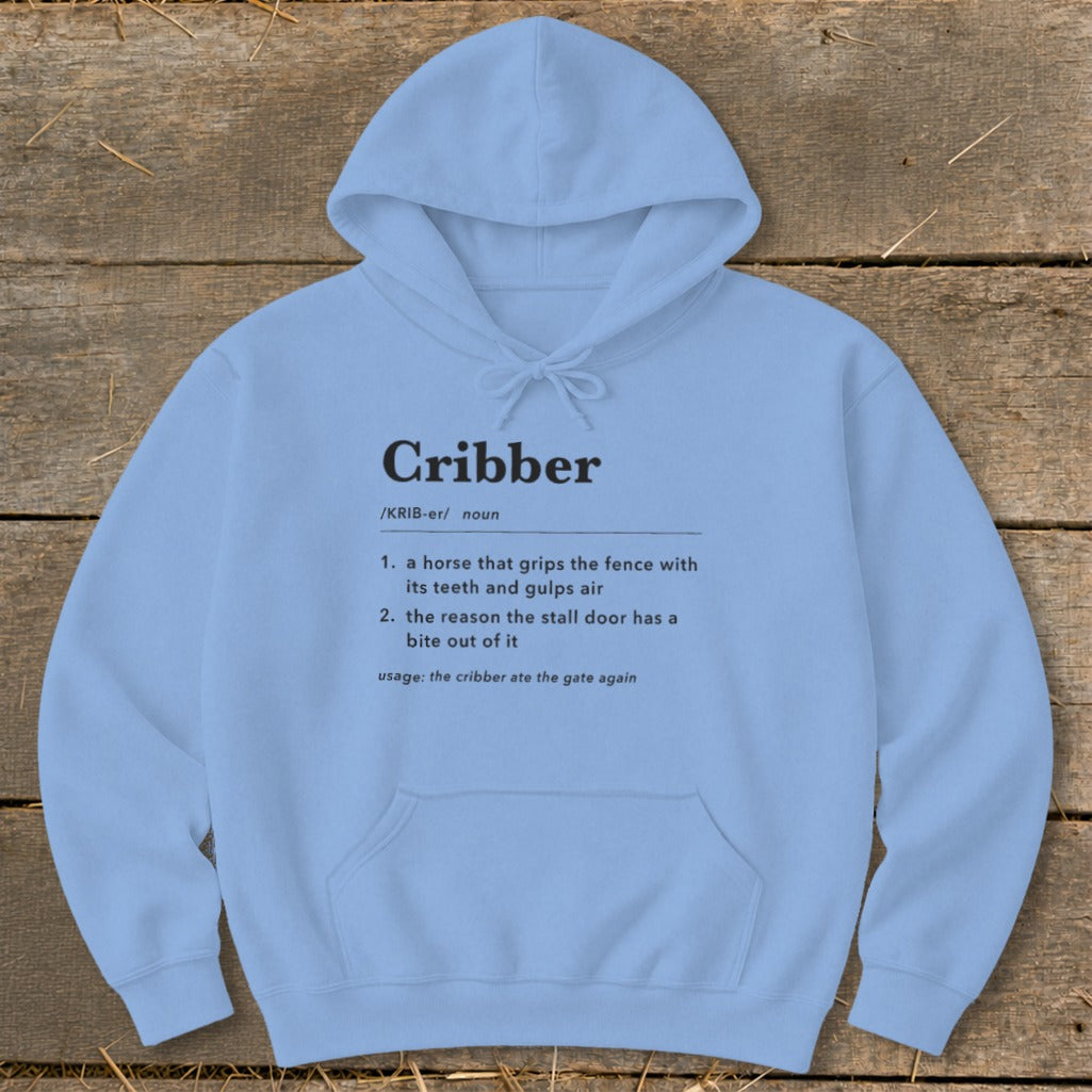 Light blue hooded sweatshirt with a funny dictionary definition of a cribbing horse printed on the chest.