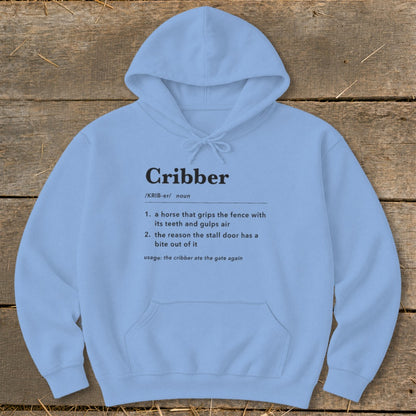 Light blue hooded sweatshirt with a funny dictionary definition of a cribbing horse printed on the chest.