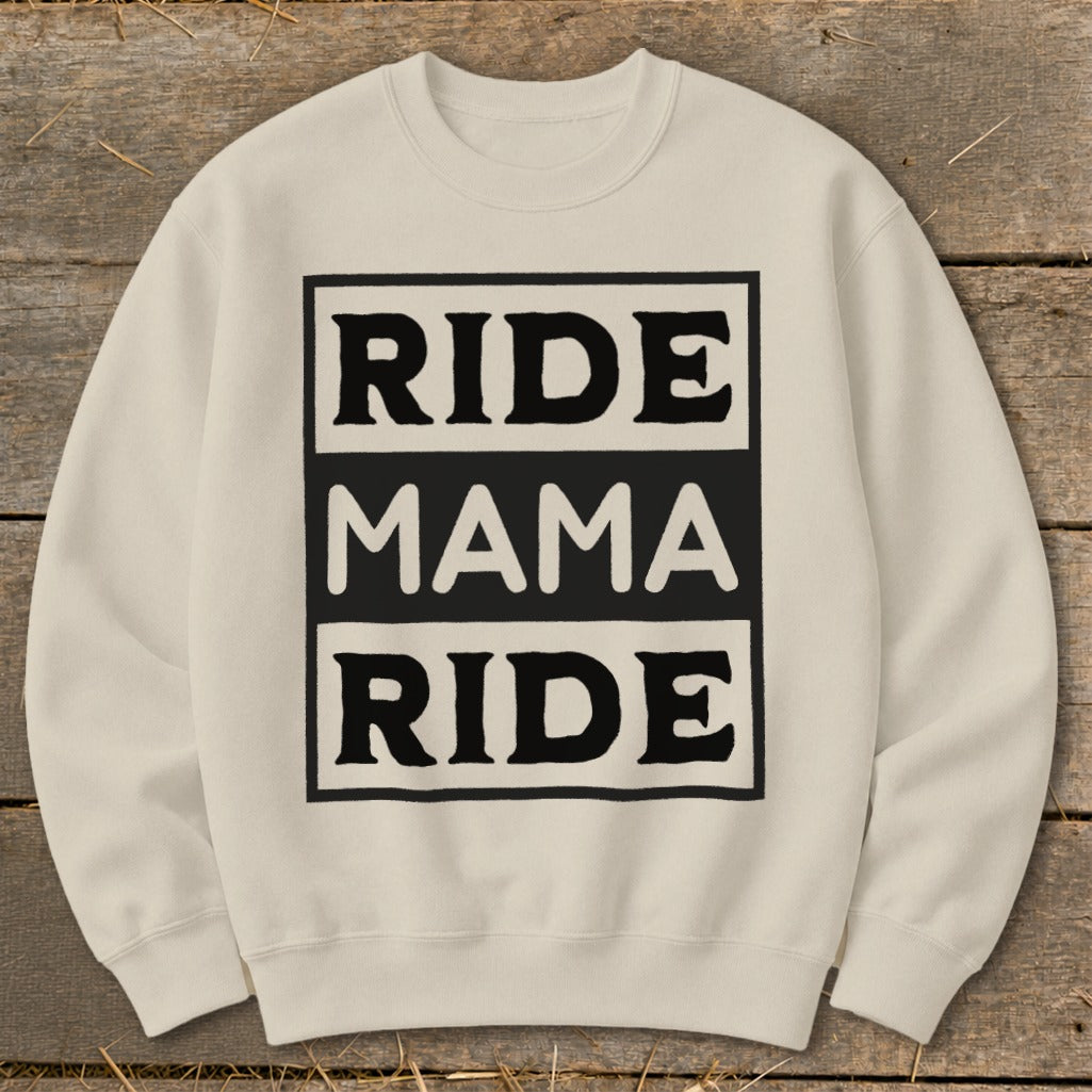 Cream sweatshirt with black text "RIDE MAMA RIDE" in a rectangular box.