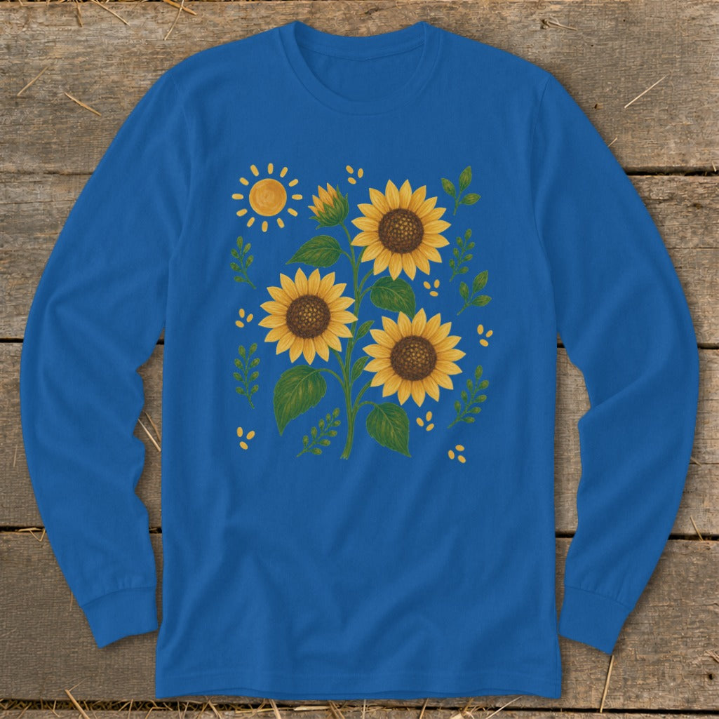 Blue long-sleeve shirt with a graphic of sunflowers, a sun, and leaves.