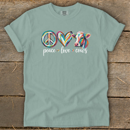 T-shirt with peace sign, heart, and cow graphic with text "peace love cows".