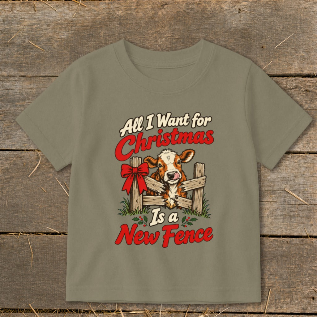 "All I Want for Christmas Is a New Fence" graphic with a cow peeking through a wooden fence.