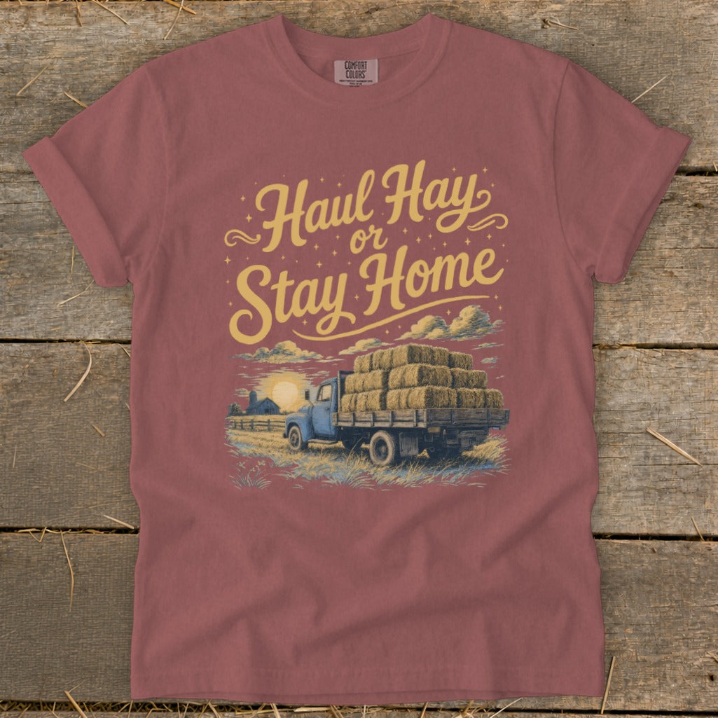 Truck loaded with hay bales and text "Haul Hay or Stay Home".