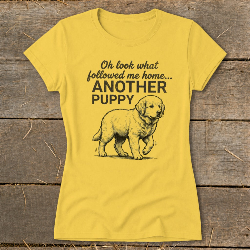 Yellow t-shirt with a puppy drawing and text "Oh look what followed me home... ANOTHER PUPPY".