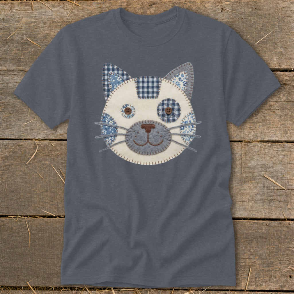 Gray t-shirt with a stitched cat face design featuring blue and white patterned fabrics.