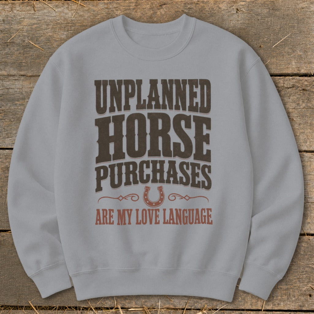 Light grey sweatshirt with text: "UNPLANNED HORSE PURCHASES ARE MY LOVE LANGUAGE"