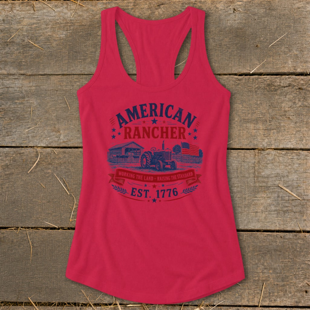 Red tank top with "American Rancher" graphic featuring a tractor, barn, and flag.