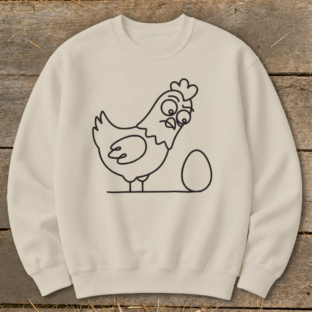 Cream sweatshirt with a cartoon chicken and egg graphic.