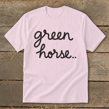 Light pink t-shirt with black cursive text "green horse.."