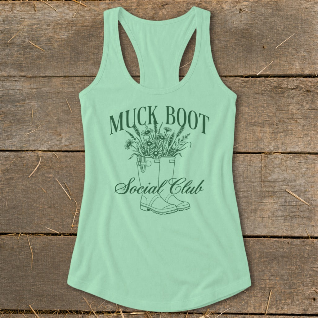 Mint green tank top with "Muck Boot Social Club" and floral design.