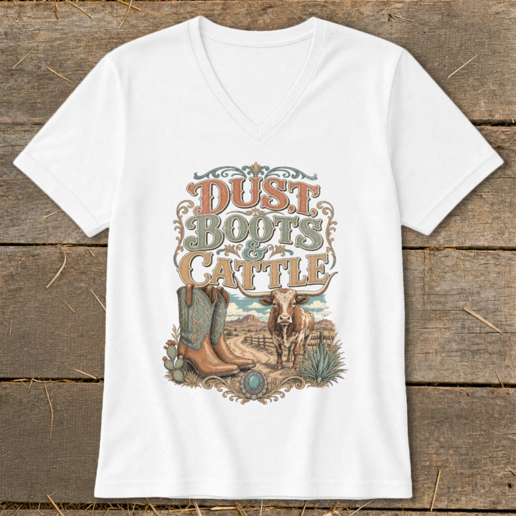 White t-shirt with vintage "Dust Boots & Cattle" graphic featuring boots, cow, and desert scene.
