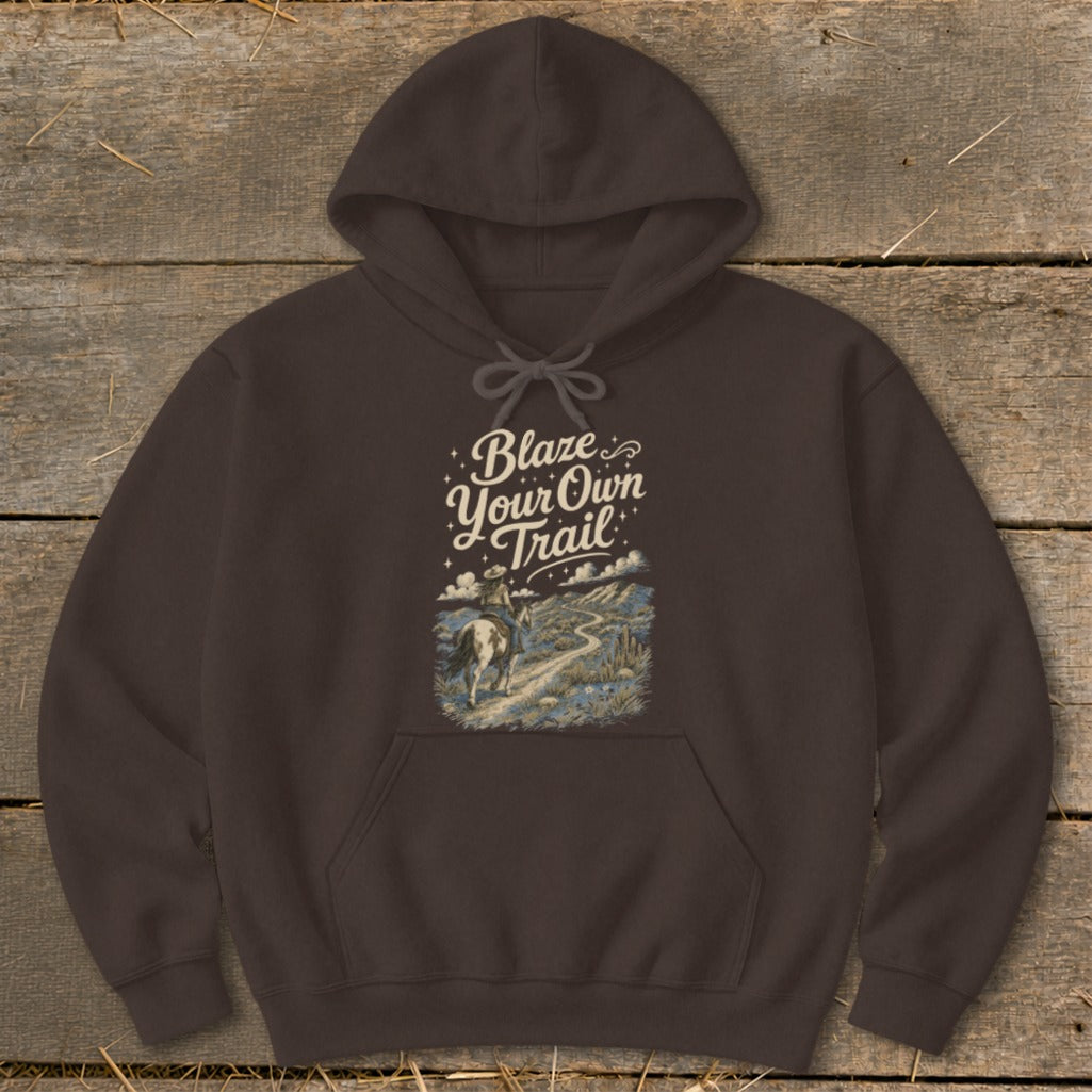 Brown hoodie with "Blaze Your Own Trail" text and a rider on horseback on a desert landscape.