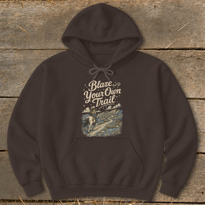 Brown hoodie with "Blaze Your Own Trail" text and a rider on horseback on a desert landscape.