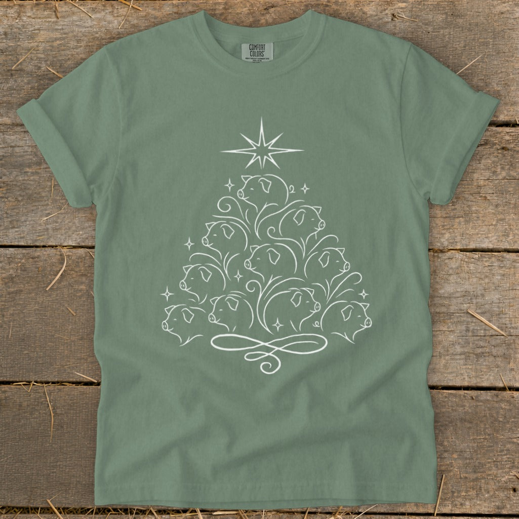 Green t-shirt with white outline art of a Christmas tree made of pigs.