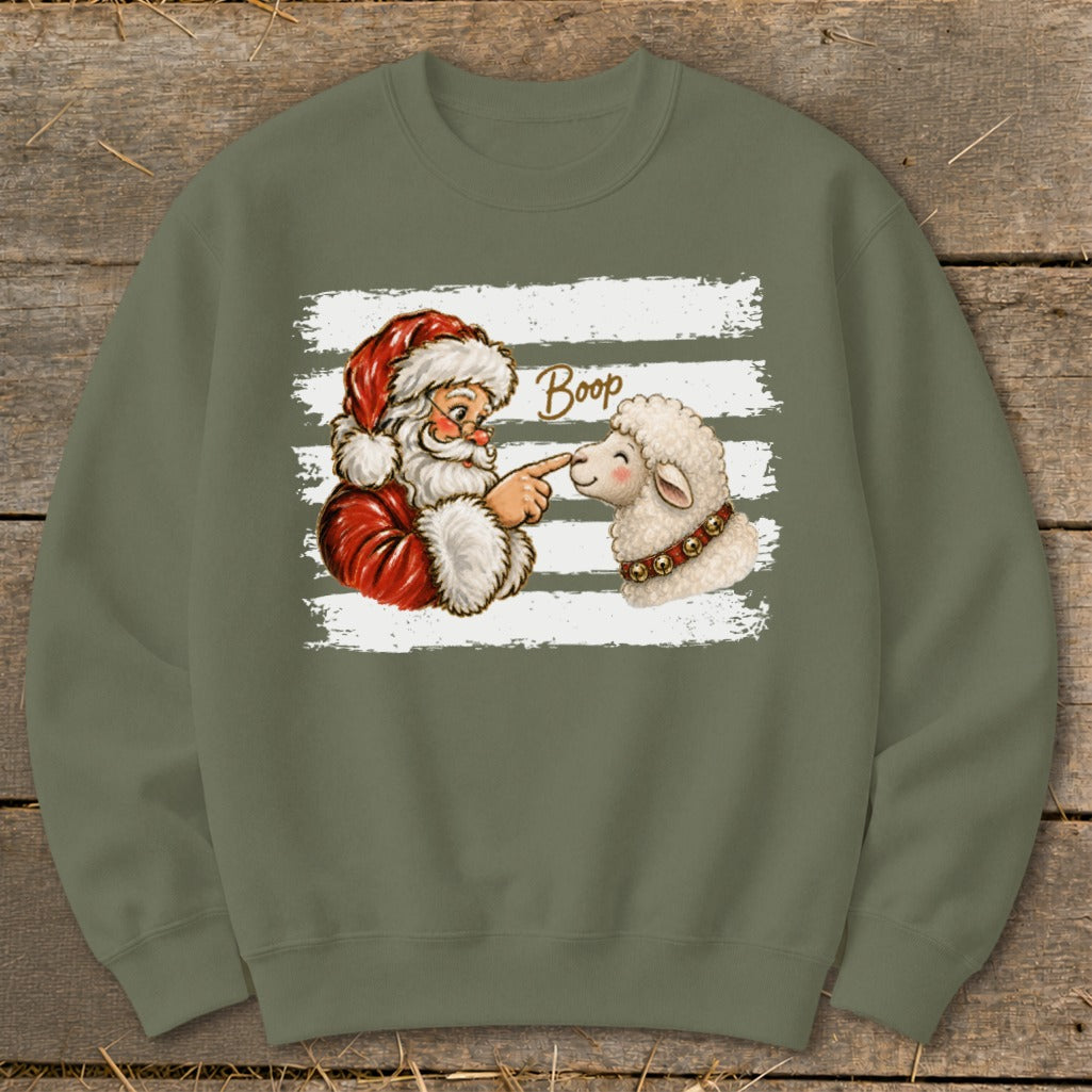 Santa booping a sheep's nose with text "Boop" on a graphic.