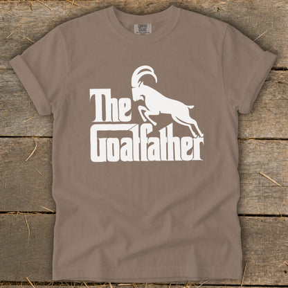 Taupe t-shirt with white "The Goalfather" text and goat graphic.