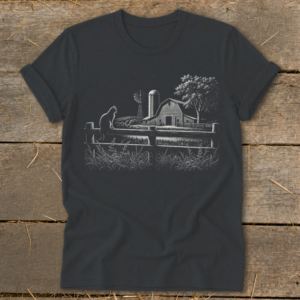 Dark t-shirt with white line art of a cat on a fence, barn, and windmill.