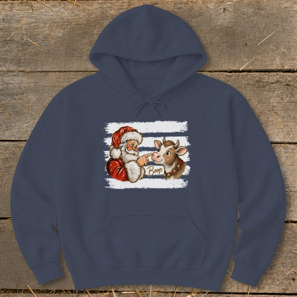 Santa booping a cow with the word "Boop" on a navy blue hoodie.