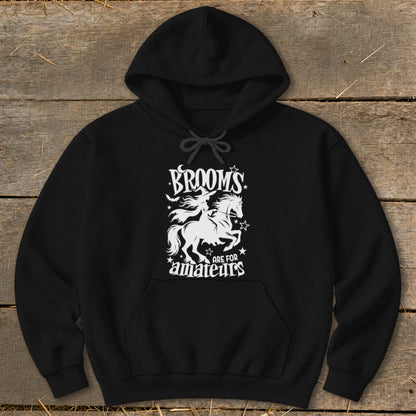 Black hoodie with "BROOMS ARE FOR AMATEURS" and witch riding a horse graphic.