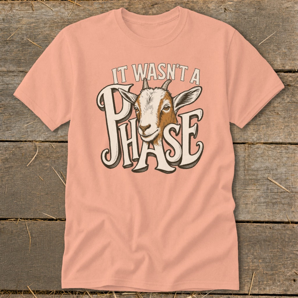 Peach t-shirt with goat graphic and text "IT WASN'T A PHASE".