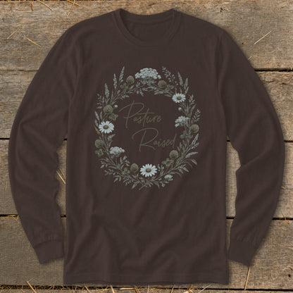 Brown long sleeve shirt with floral wreath graphic that reads "Pasture Raised".
