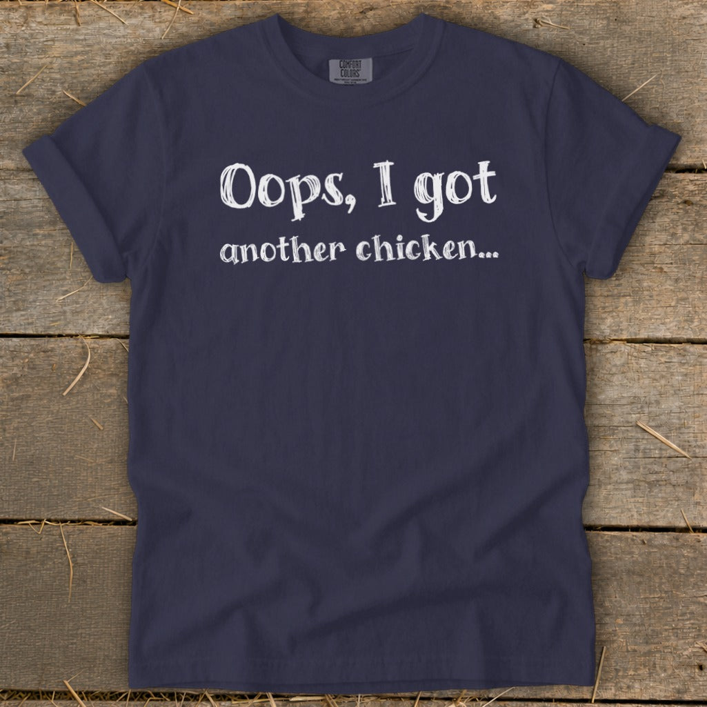Navy blue t-shirt with white text "Oops, I got another chicken..."
