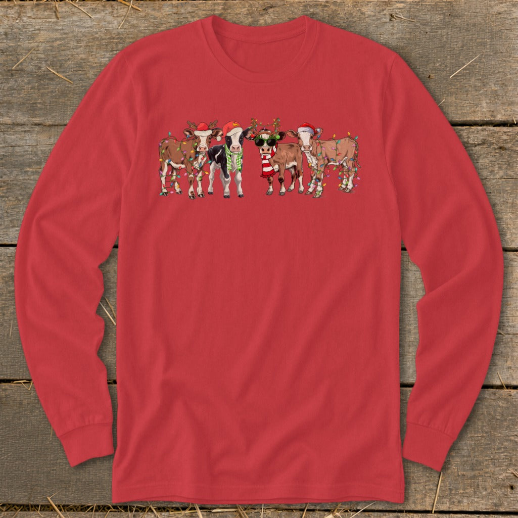 Red long sleeve shirt with cartoon cows wearing Santa hats and Christmas lights.